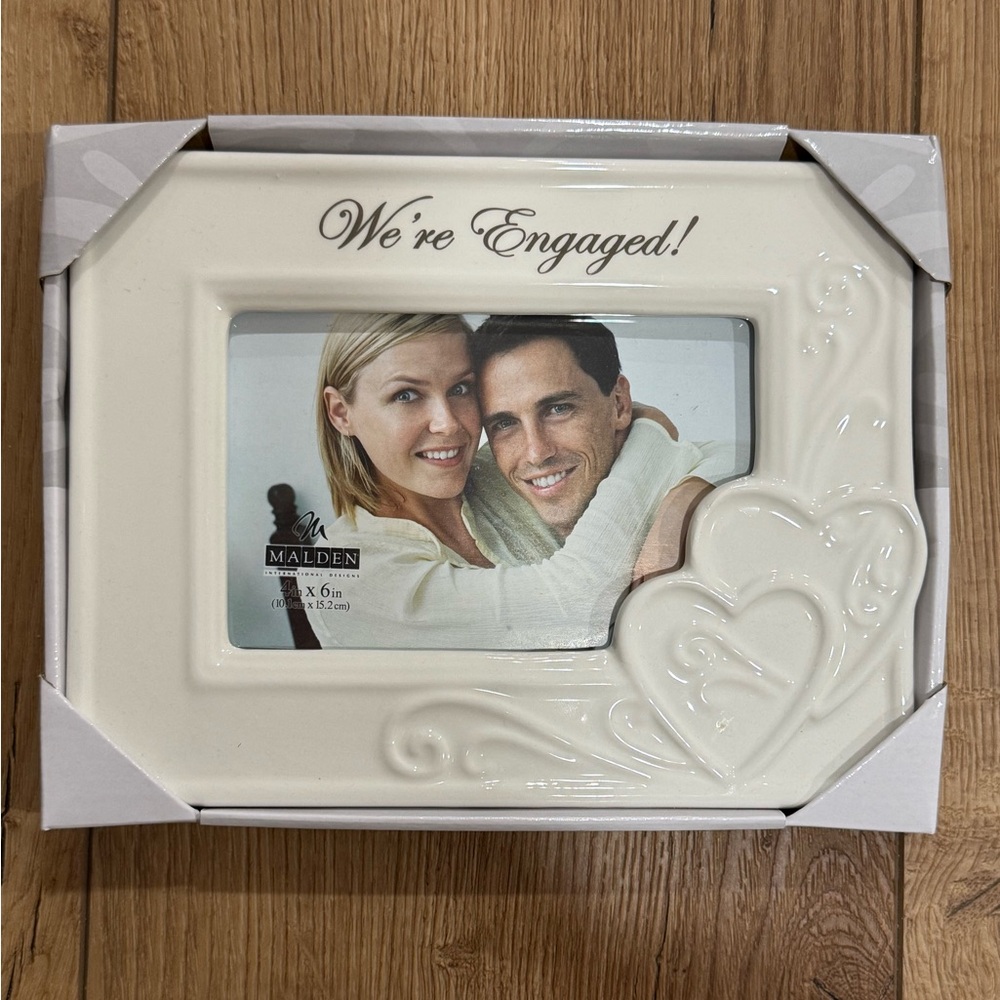 “We’re engaged” picture frame